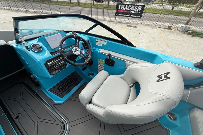 Slide: The Image of Interior of 2023 Heyday WT-2DC boat with blue dashboard and steering wheel. - 10