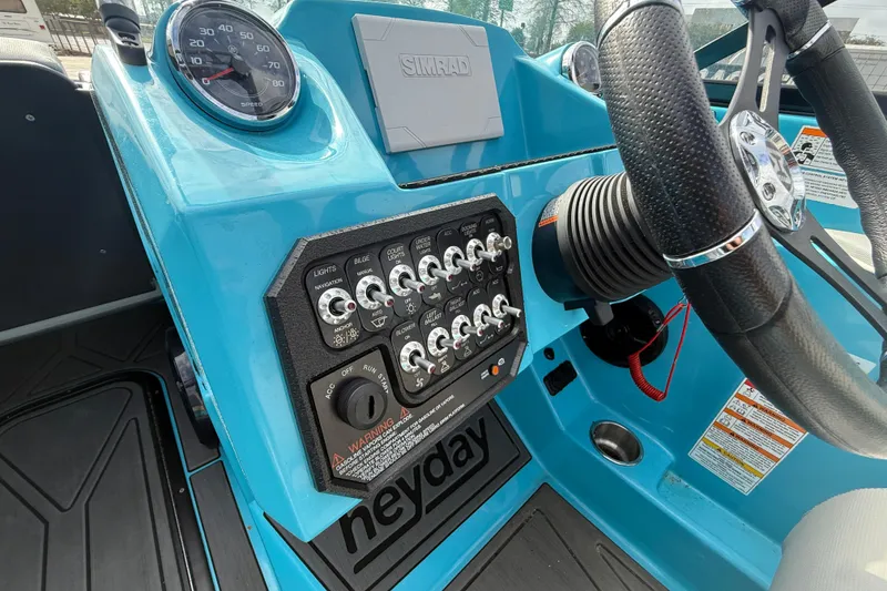 Slide: The Image of 2023 Heyday WT-2DC boat dashboard with controls and steering wheel. - 12