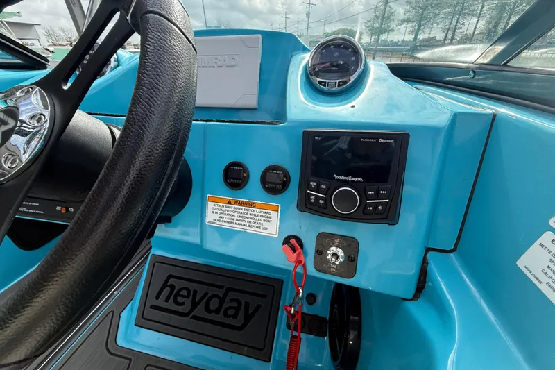 Slide: The Image of 2023 Heyday WT-2DC boat dashboard with steering wheel and control panel. - 13