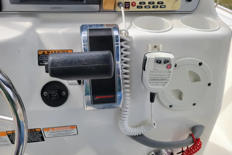Slide: The Image of Center console controls of a 2010 Trophy 1703 boat with Mercury throttle. - 18
