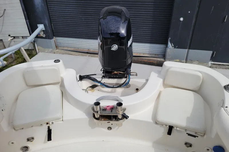 Slide: The Image of 2010 Trophy 1703 Center Console boat with outboard motor and seating. - 23