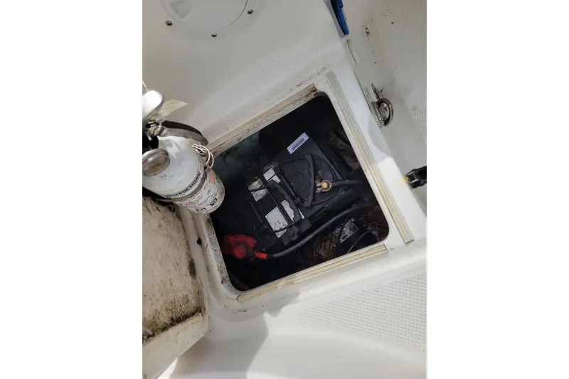 Slide: The Image of 2010 Trophy 1703 Center Console boat battery compartment with fire extinguisher. - 25