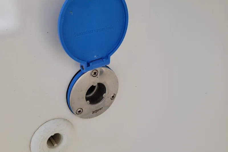 Slide: The Image of Boat water inlet with blue cover on 2010 Trophy 1703 Center Console. - 26