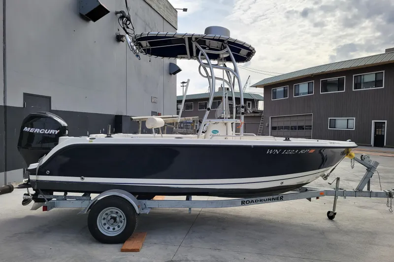 Slide: The Image of 2010 Trophy 1703 Center Console boat on trailer, featuring Mercury outboard motor. - 5