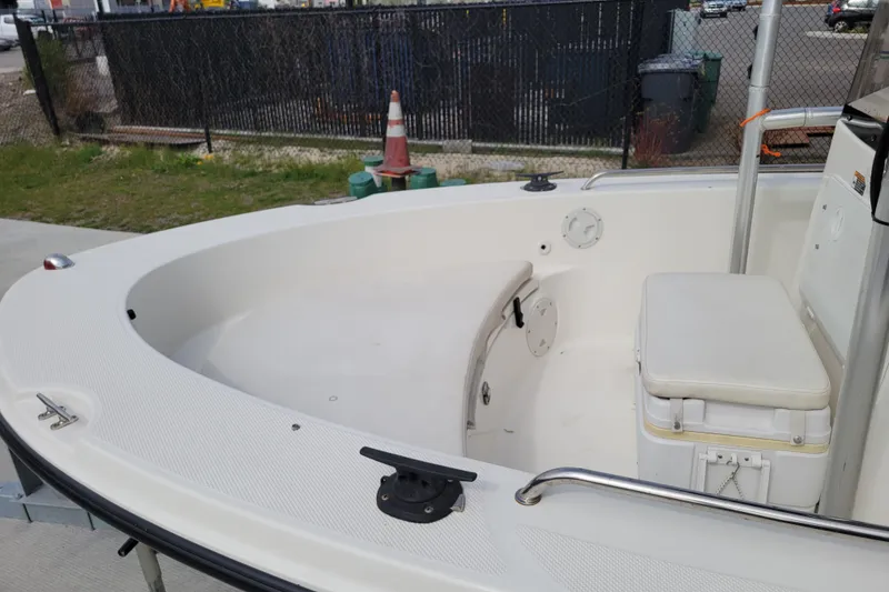 Slide: The Image of 2010 Trophy 1703 Center Console boat interior with seating and storage. - 8