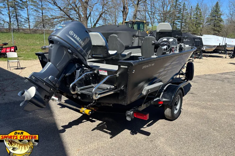 Slide: The Image of 2019 Starcraft Stealth 166 SC boat with Yamaha motor on trailer, outdoor setting. - 19