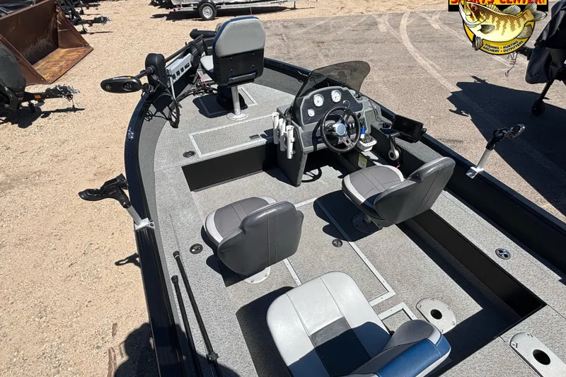 Slide: The Image of 2019 Starcraft Stealth 166 SC boat interior with steering console and seating. - 23