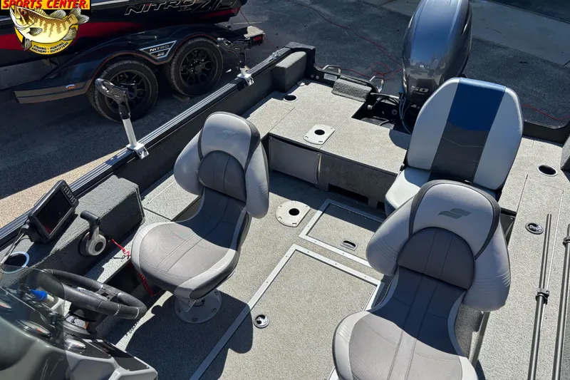 Slide: The Image of 2019 Starcraft Stealth 166 SC boat interior with seating and motor, displayed at a sports center. - 24