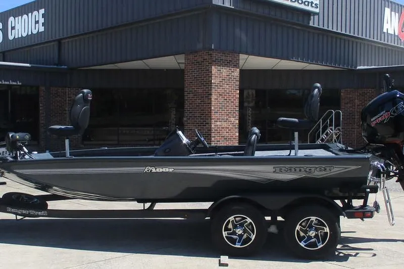 The Image of 2026 Ranger RT188P fishing boat on trailer outside dealership. - 1