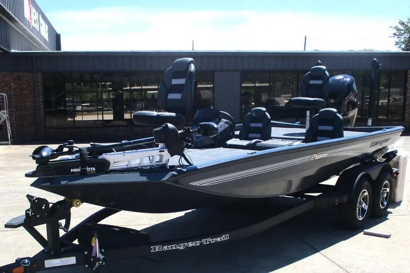 Slide: The Image of 2026 Ranger RT188P fishing boat on trailer, parked outdoors. - 12