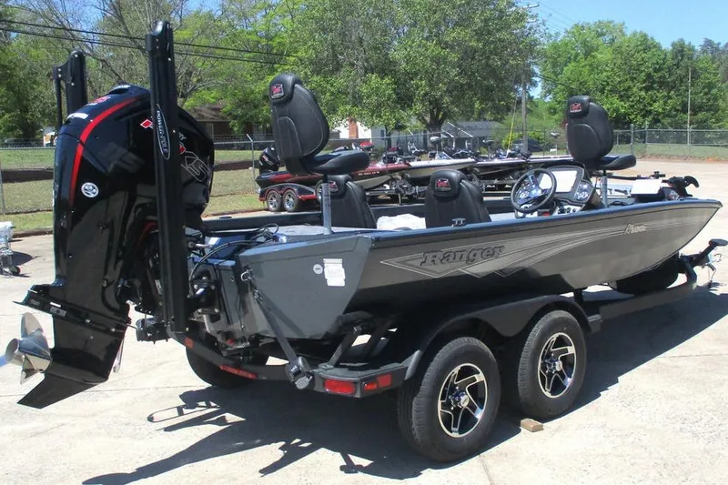Slide: The Image of 2026 Ranger RT188P fishing boat on trailer, featuring sleek design and powerful outboard motor. - 3