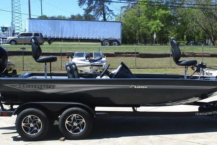 Slide: The Image of 2026 Ranger RT188P fishing boat on trailer, parked outdoors. - 4