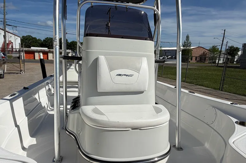 Slide: The Image of 2017 Epic 23 Sport Console boat interior with seating and console view. - 12