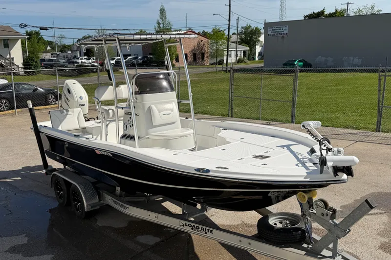 Slide: The Image of 2017 Epic 23 Sport Console boat on trailer, parked outdoors on a sunny day. - 4