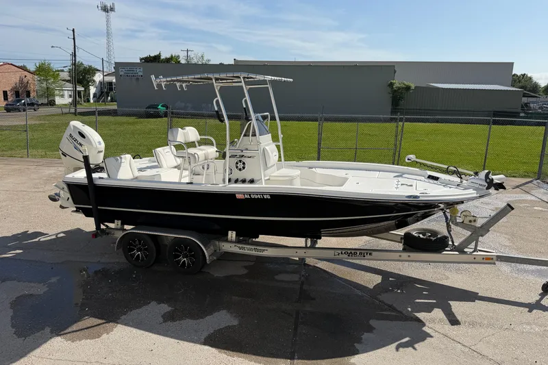 Slide: The Image of 2017 Epic 23 Sport Console boat on trailer, parked outdoors. - 5