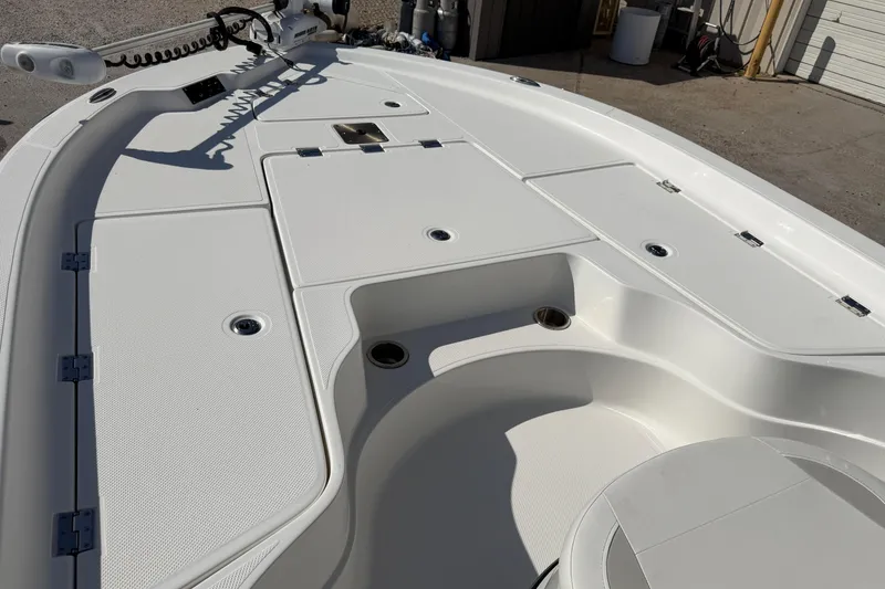 Slide: The Image of 2017 Epic 23 Sport Console boat deck with storage compartments and seating. - 8