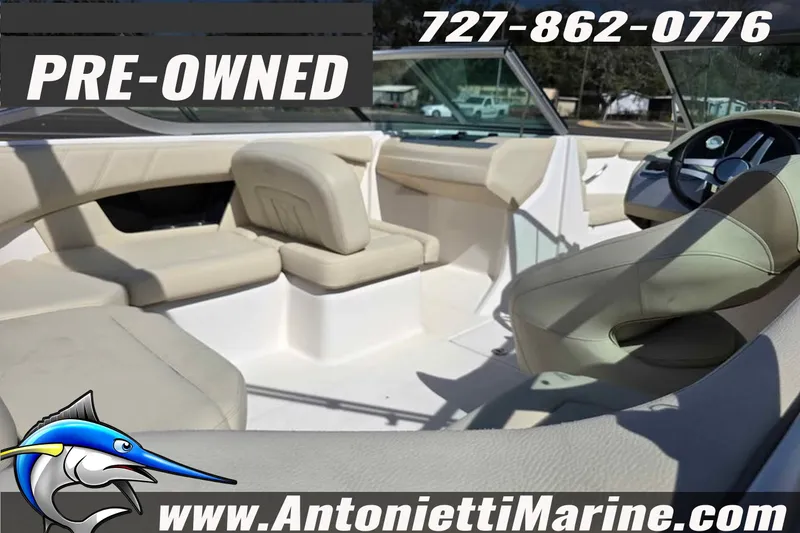 Slide: The Image of Pre-owned 2020 Regal 21 OBX boat interior with beige seating, available at Antonietti Marine. - 16