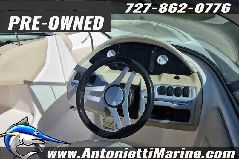 Slide: The Image of Pre-owned 2020 Regal 21 OBX boat dashboard with steering wheel and controls. - 4