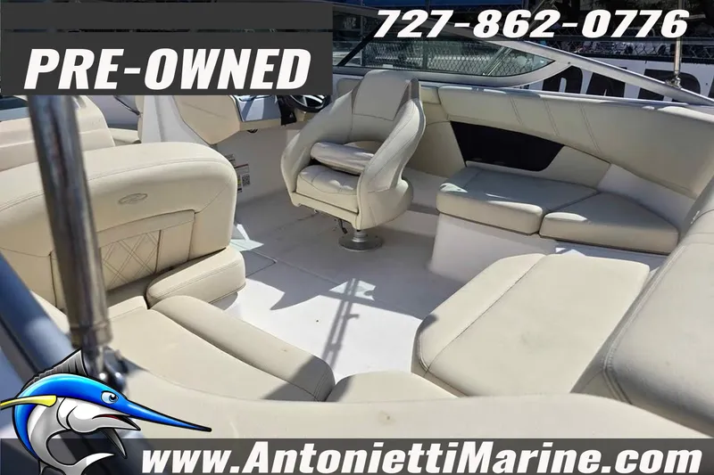 Slide: The Image of Pre-owned 2020 Regal 21 OBX boat interior with beige seating, available at Antonietti Marine. - 9
