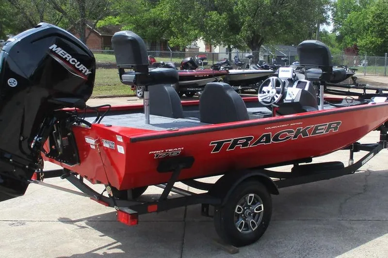 Slide: The Image of 2026 Tracker Pro Team 175 boat with Mercury engine on trailer, parked outdoors. - 3