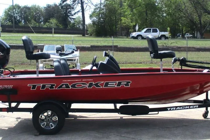 Slide: The Image of 2026 Tracker Pro Team 175 boat in red on trailer, parked outdoors. - 6