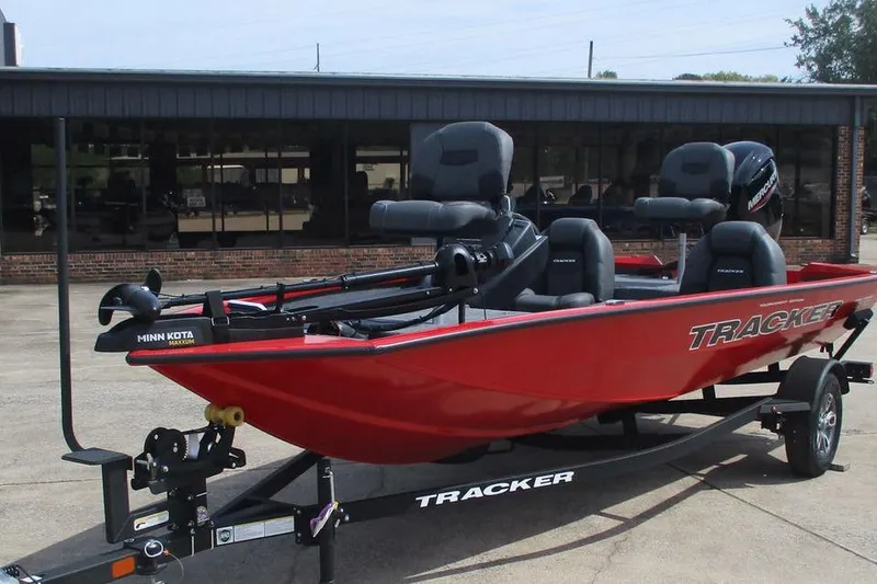 Slide: The Image of 2026 Tracker Pro Team 175 boat in red, equipped with Minn Kota motor, on a trailer. - 8