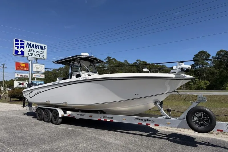 The Image of 2004 Fountain Bluewater 34 CC boat on trailer at Marine Service Center. - 1
