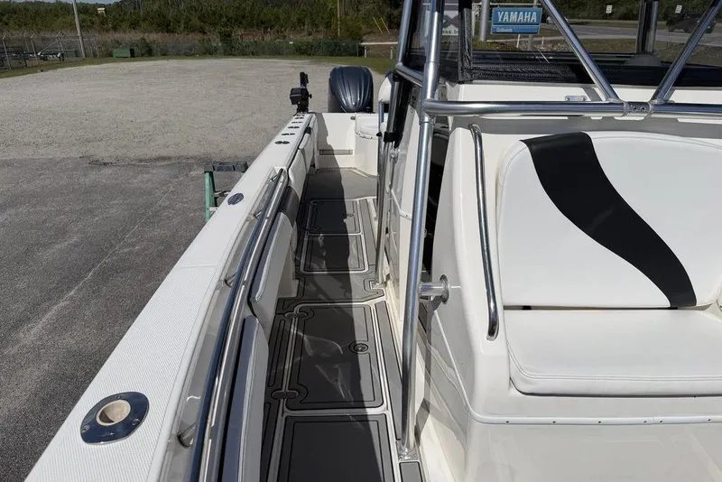 Slide: The Image of 2004 Fountain Bluewater 34 CC boat interior with sleek seating and modern design. - 16