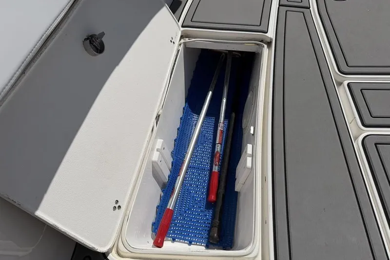 Slide: The Image of Storage compartment on 2004 Fountain Bluewater 34 CC boat with tools inside. - 18