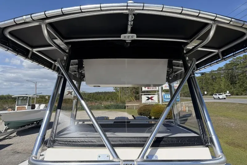 Slide: The Image of 2004 Fountain Bluewater 34 CC boat with sturdy T-top and clear windshield. - 22