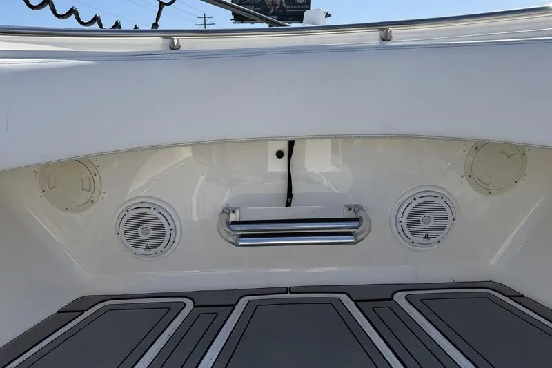 Slide: The Image of 2004 Fountain Bluewater 34 CC boat interior with speakers and stainless steel handle. - 24