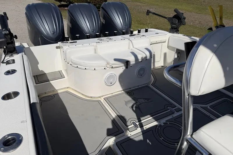 Slide: The Image of 2004 Fountain Bluewater 34 CC boat interior with triple Yamaha engines. - 32