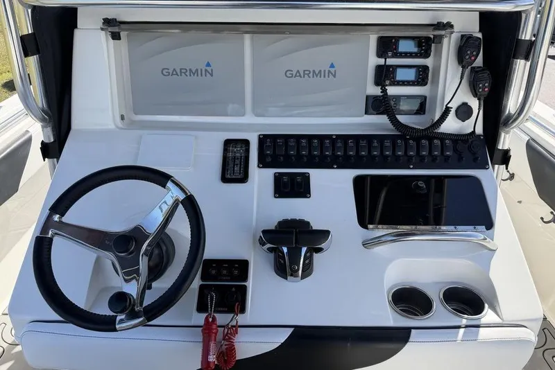 Slide: The Image of Console of a 2004 Fountain Bluewater 34 CC boat with Garmin electronics. - 37