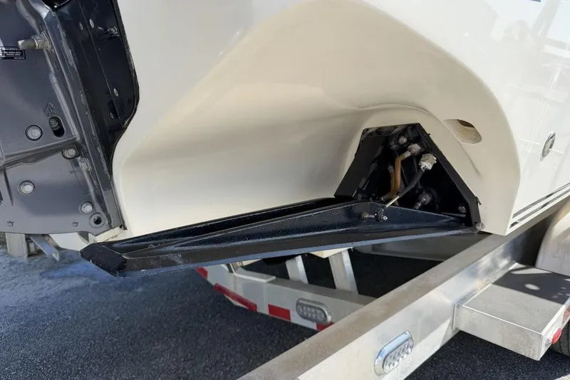 Slide: The Image of 2004 Fountain Bluewater 34 CC boat detail on trailer, showcasing hull and components. - 49