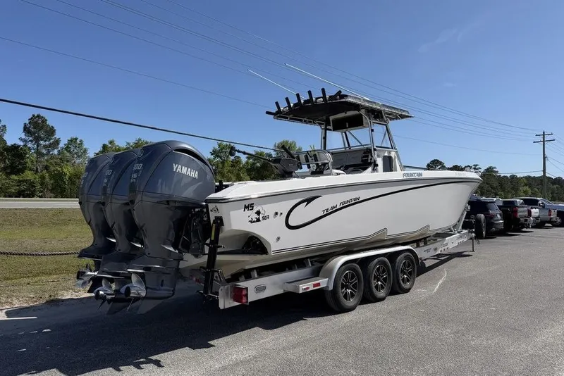 Slide: The Image of 2004 Fountain Bluewater 34 CC boat on trailer with triple Yamaha engines. - 5