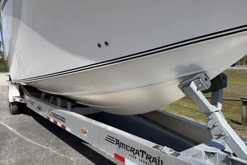Slide: The Image of 2004 Fountain Bluewater 34 CC boat on AmeraTrail trailer, side view. - 56
