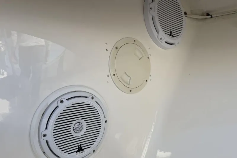 Slide: The Image of Speakers and hatch on 2004 Fountain Bluewater 34 CC boat interior. - 57