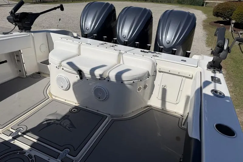Slide: The Image of 2004 Fountain Bluewater 34 CC boat interior with triple outboard engines. - 6
