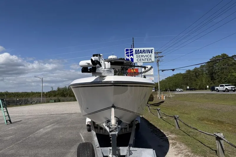 Slide: The Image of 2004 Fountain Bluewater 34 CC boat at marine service center under clear blue sky. - 70