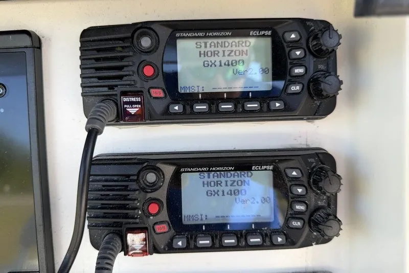 Slide: The Image of Standard Horizon GX1400 radios on a 2004 Fountain Bluewater 34 CC boat dashboard. - 71
