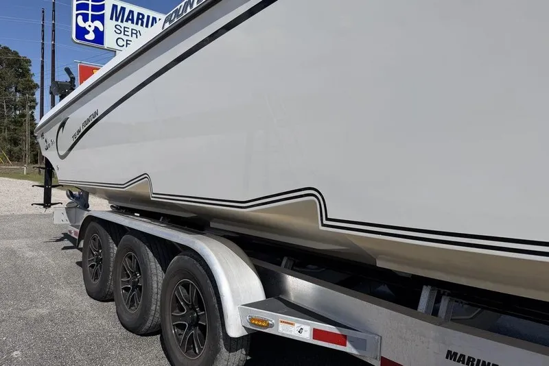 Slide: The Image of 2004 Fountain Bluewater 34 CC boat on trailer at marina service center. - 72