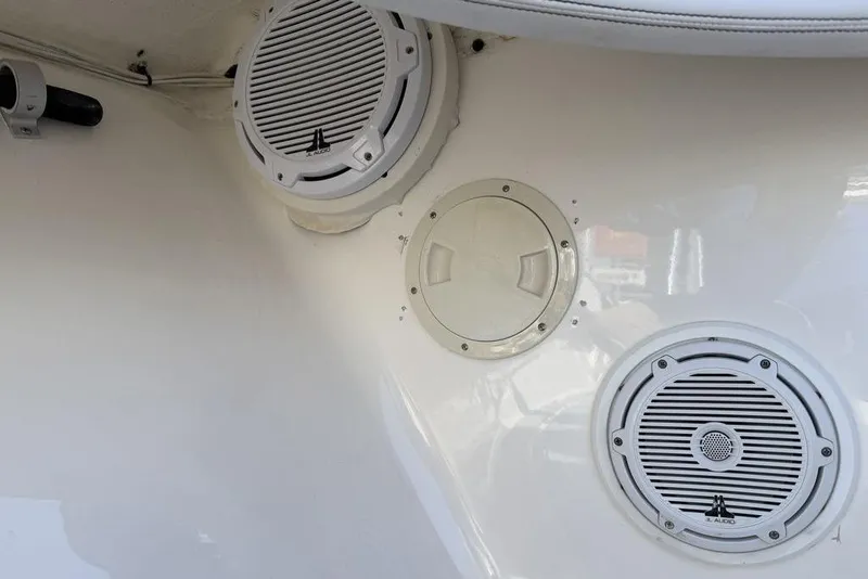 Slide: The Image of Speakers and hatch on 2004 Fountain Bluewater 34 CC boat interior. - 74
