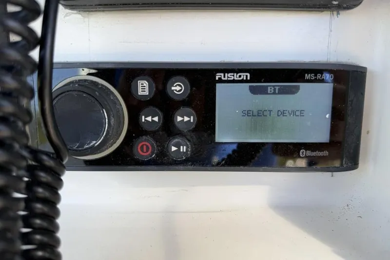 Slide: The Image of Bluetooth stereo system on 2004 Fountain Bluewater 34 CC boat dashboard. - 75