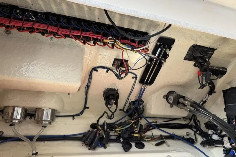 Slide: The Image of Wiring and components inside a 2004 Fountain Bluewater 34 CC boat. - 82