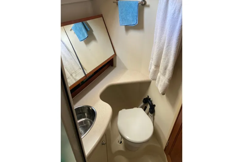 Slide: The Image of Compact bathroom in 2006 Hunter 45 CC yacht with sink, toilet, and mirror. - 10