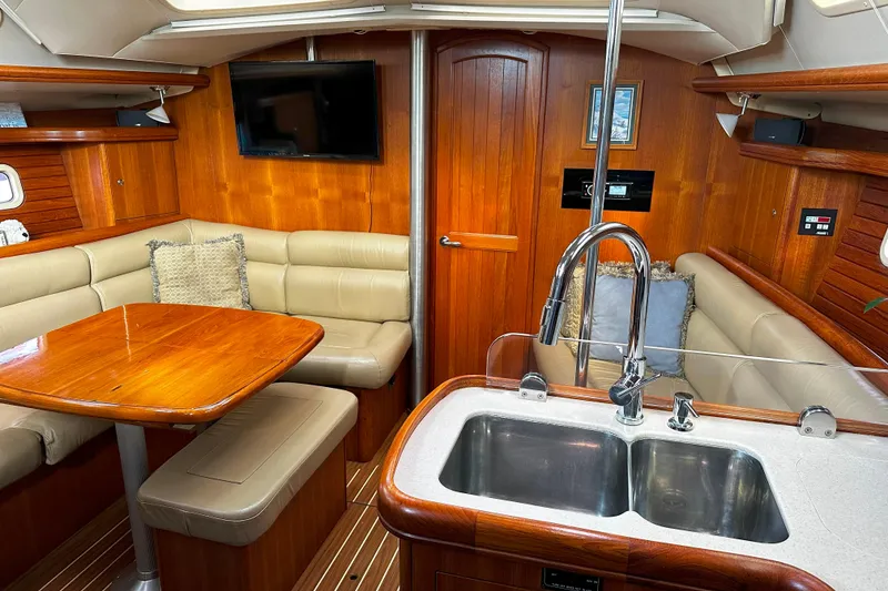 Slide: The Image of Luxurious interior of 2006 Hunter 45 CC yacht with wood finish and modern amenities. - 16