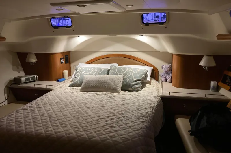 Slide: The Image of Luxurious cabin interior of 2006 Hunter 45 CC yacht with cozy bed and ambient lighting. - 3