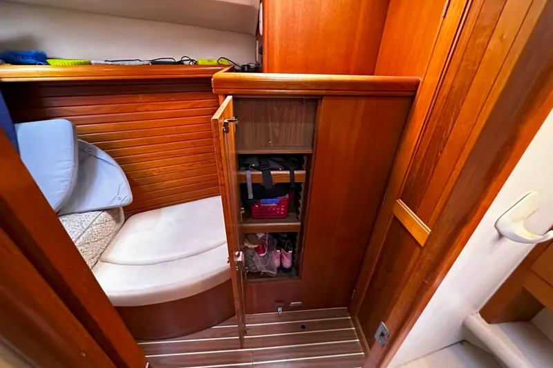 Slide: The Image of Interior of 2006 Hunter 45 CC sailboat with wooden cabinetry and seating area. - 35