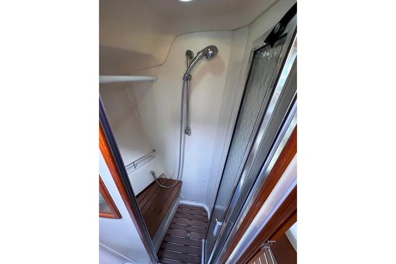 Slide: The Image of Shower area in 2006 Hunter 45 CC yacht with wooden flooring and modern fixtures. - 38