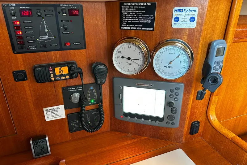 Slide: The Image of Control panel of a 2006 Hunter 45 CC sailboat with navigation and communication equipment. - 39